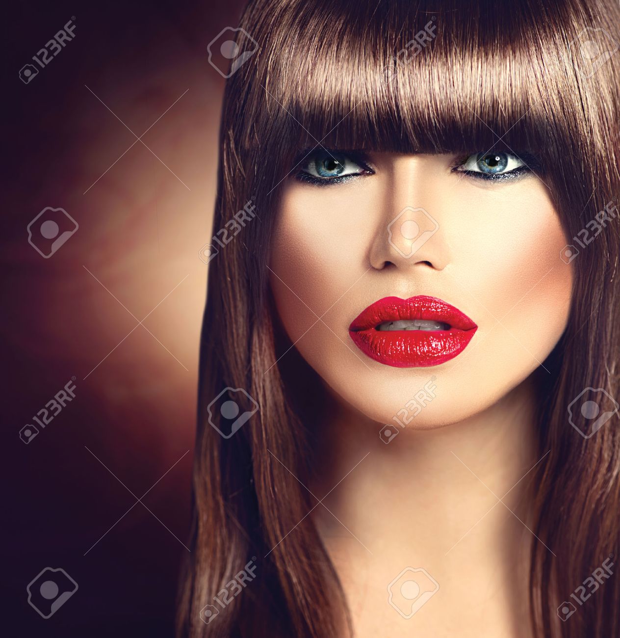 Beautiful Brunette Woman With Fashion Fringe Haircut