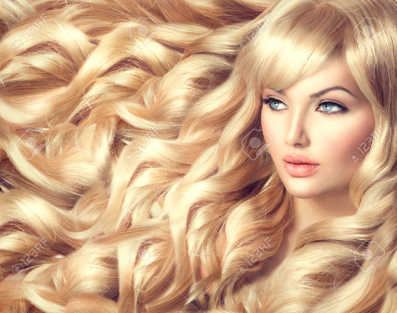 Beautiful Model Girl With Long Curly Blond Hair