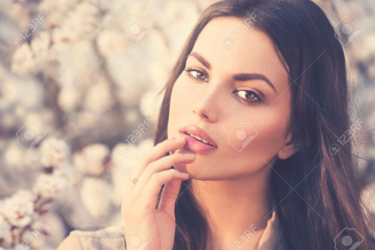 Spring fashion girl outdoors portrait in blooming trees - 54596689 Spring fashion girl outdoors portrait in blooming trees - 54596689