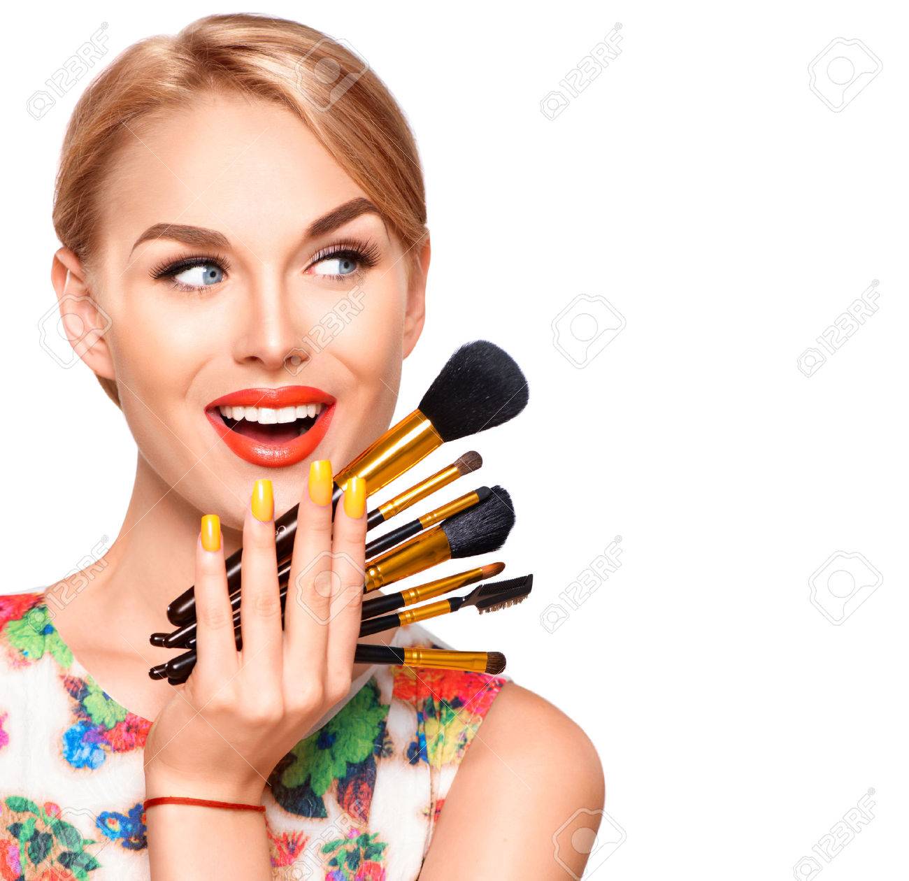 Beauty woman with makeup brushes. Applying holiday makeup - 55256201 Beauty woman with makeup brushes. Applying holiday makeup - 55256201