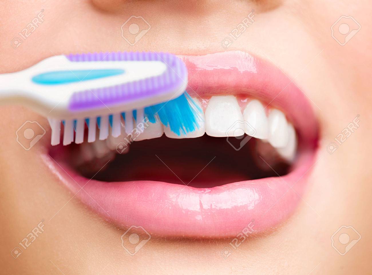 Teeth brushing. Beautiful white healthy teeth - 58925067 Teeth brushing. Beautiful white healthy teeth - 58925067