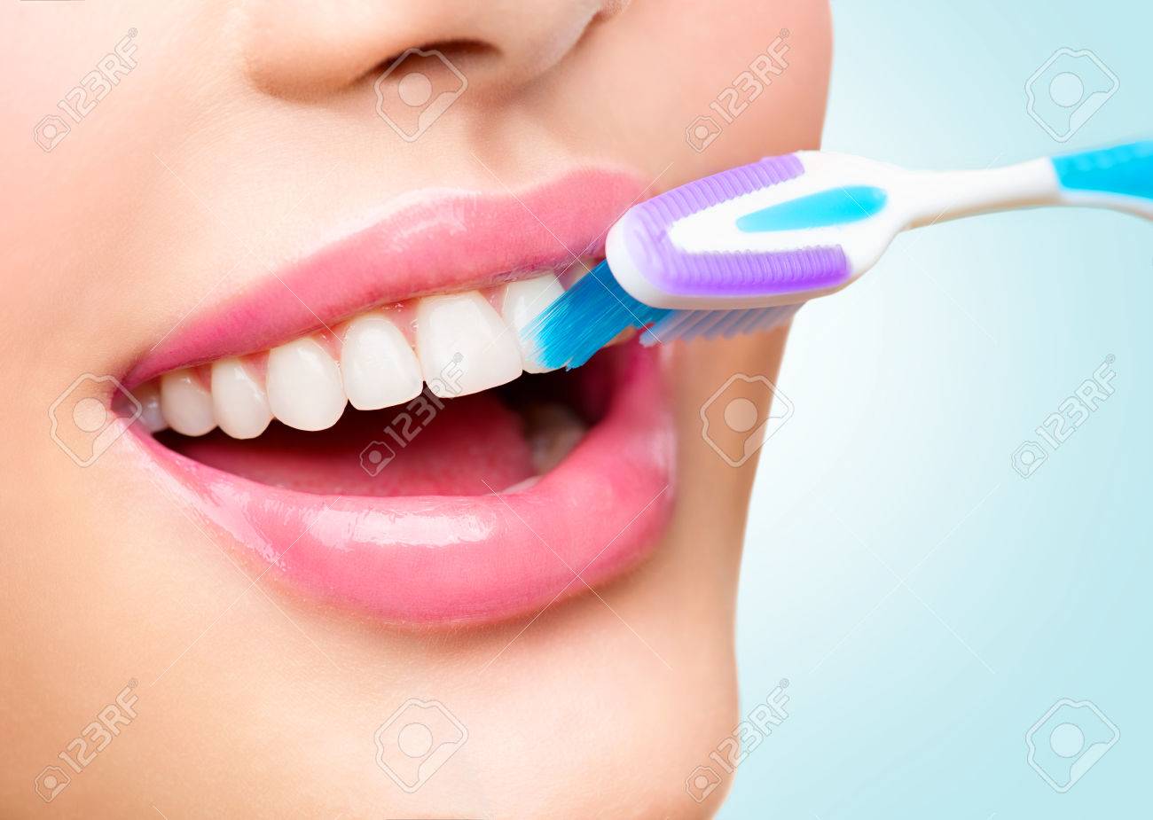 Teeth brushing. Beautiful white healthy teeth - 58925071 Teeth brushing. Beautiful white healthy teeth - 58925071