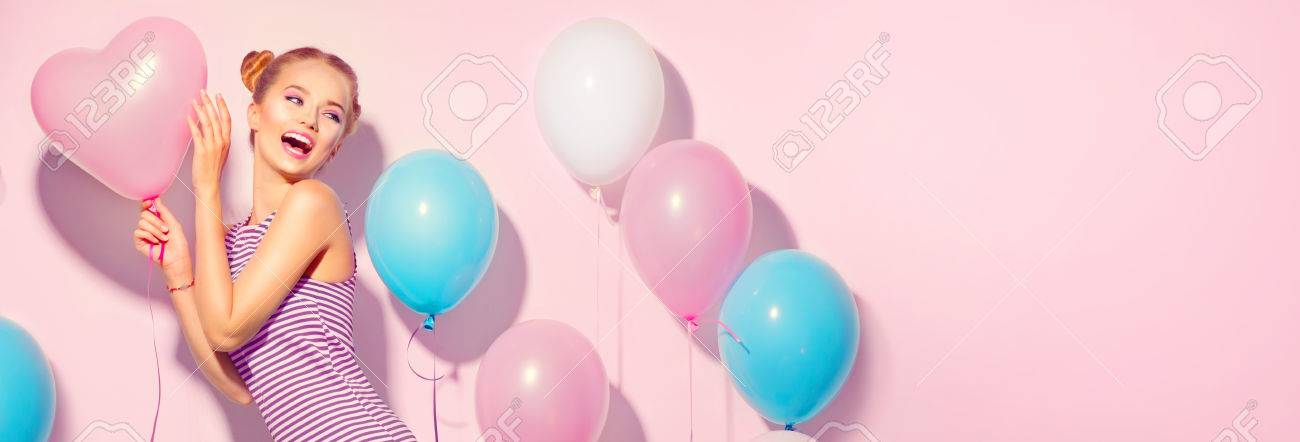 Beauty joyful teenage girl with colorful air balloons having fun over pink background - 84326555 Beauty joyful teenage girl with colorful air balloons having fun over pink background - 84326555