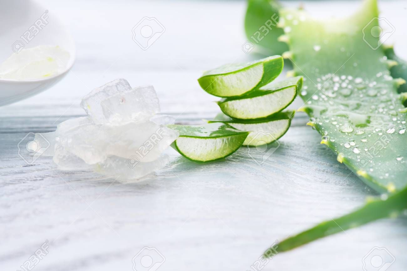 Aloe Vera gel closeup. Sliced Aloevera natural organic renewal cosmetics, alternative medicine. Organic skincare concept. On white wooden background - 96466679 Aloe Vera gel closeup. Sliced Aloevera natural organic renewal cosmetics, alternative medicine. Organic skincare concept. On white wooden background - 96466679