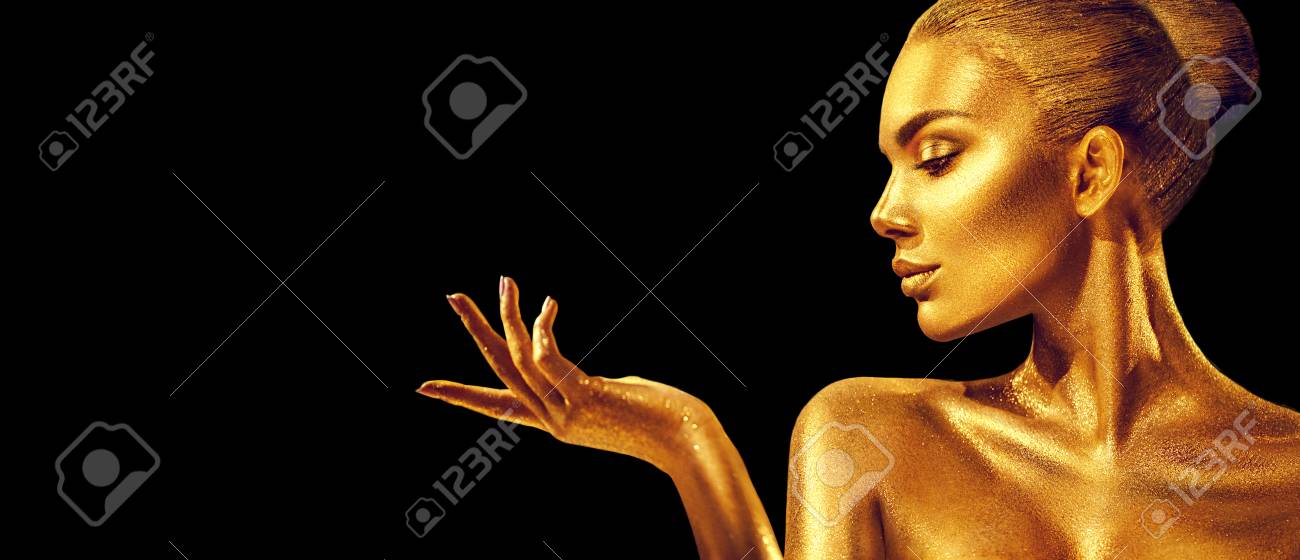 Golden woman. Beauty fashion model girl with golden skin, makeup, hair and jewellery on black background. Fashion art portrait - 112144826 Golden woman. Beauty fashion model girl with golden skin, makeup, hair and jewellery on black background. Fashion art portrait - 112144826