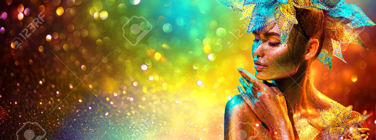 Golden Fashion model woman with bright golden sparkles on skin posing, fantasy flower, portrait of beautiful girl glowing makeup. Art design gold sequins make up. Glitter glowing skin, jewellery, neon - 130585495 Golden Fashion model woman with bright golden sparkles on skin posing, fantasy flower, portrait of beautiful girl glowing makeup. Art design gold sequins make up. Glitter glowing skin, jewellery, neon - 130585495