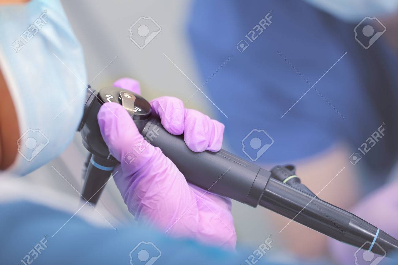 Endoscope in doctor`s hand during medical test. - 80623810 Endoscope in doctor`s hand during medical test. - 80623810
