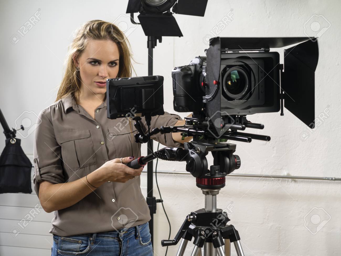 Photo Of A Woman Operating A Dslr Camera Rig For A Video Shoot. Stock  Photo, Picture And Royalty Free Image. Image 114809944.