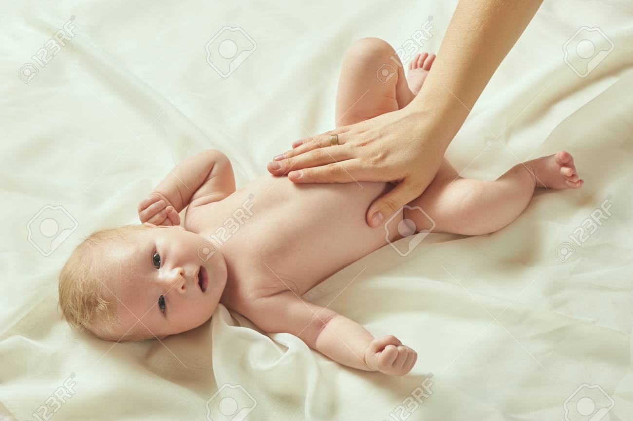 Blond Babe Lies On The Bed And Receives A Tummy Massage Stock Photo 103364577 Blond Babe Lies On The Bed And Receives A Tummy Massage Stock Photo 103364577