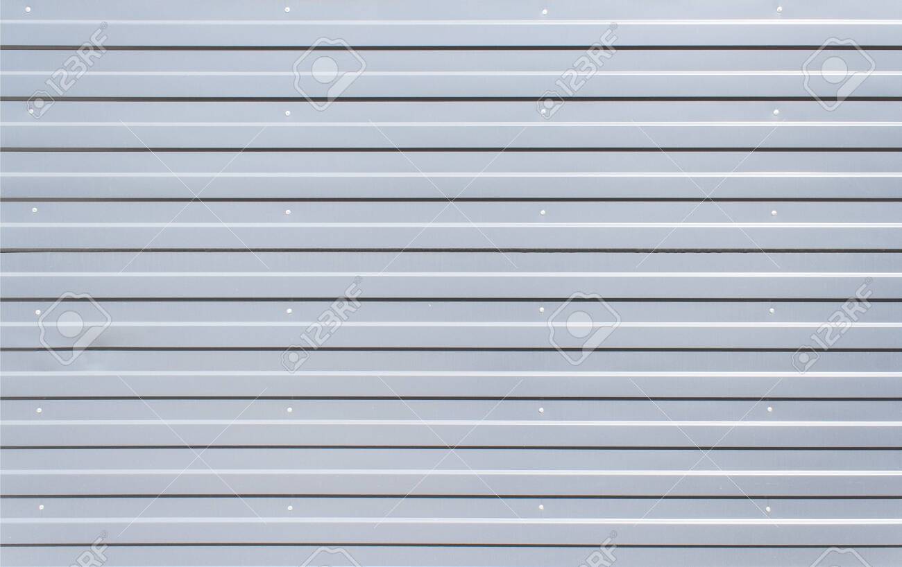Sheet Metal With Little Texture Grey Color. Sheet Material For Metalwork  Walls. Silver Iron Wall. Corrugated Iron. Galvanized Iron Wall Plate  Background. Sheet Wall Panel. Stock Photo, Picture and Royalty Free Image., image size:1300x818