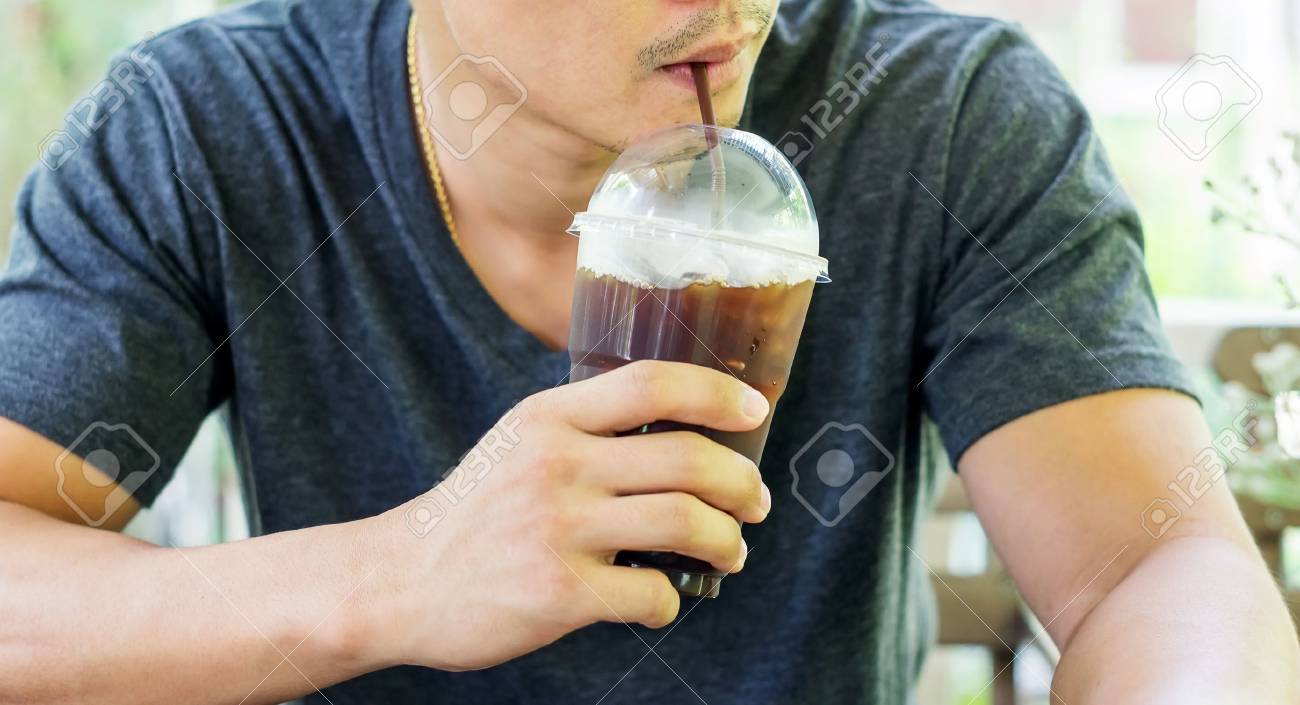 Man Drinking An Iced Coffee In A Shop Stock Photo Man Drinking An Iced Coffee In A Shop Stock Photo