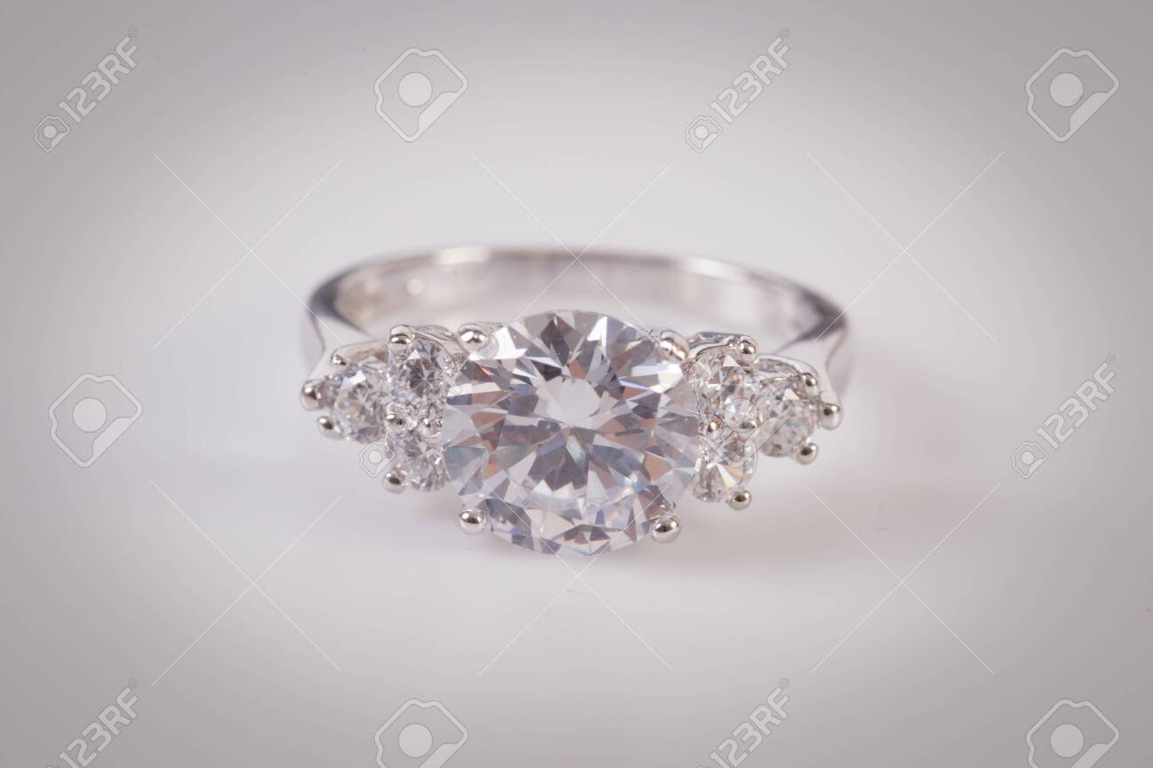 Close up of elegant diamond ring on the white background. Diamond ring. - 137065933 Close up of elegant diamond ring on the white background. Diamond ring. - 137065933