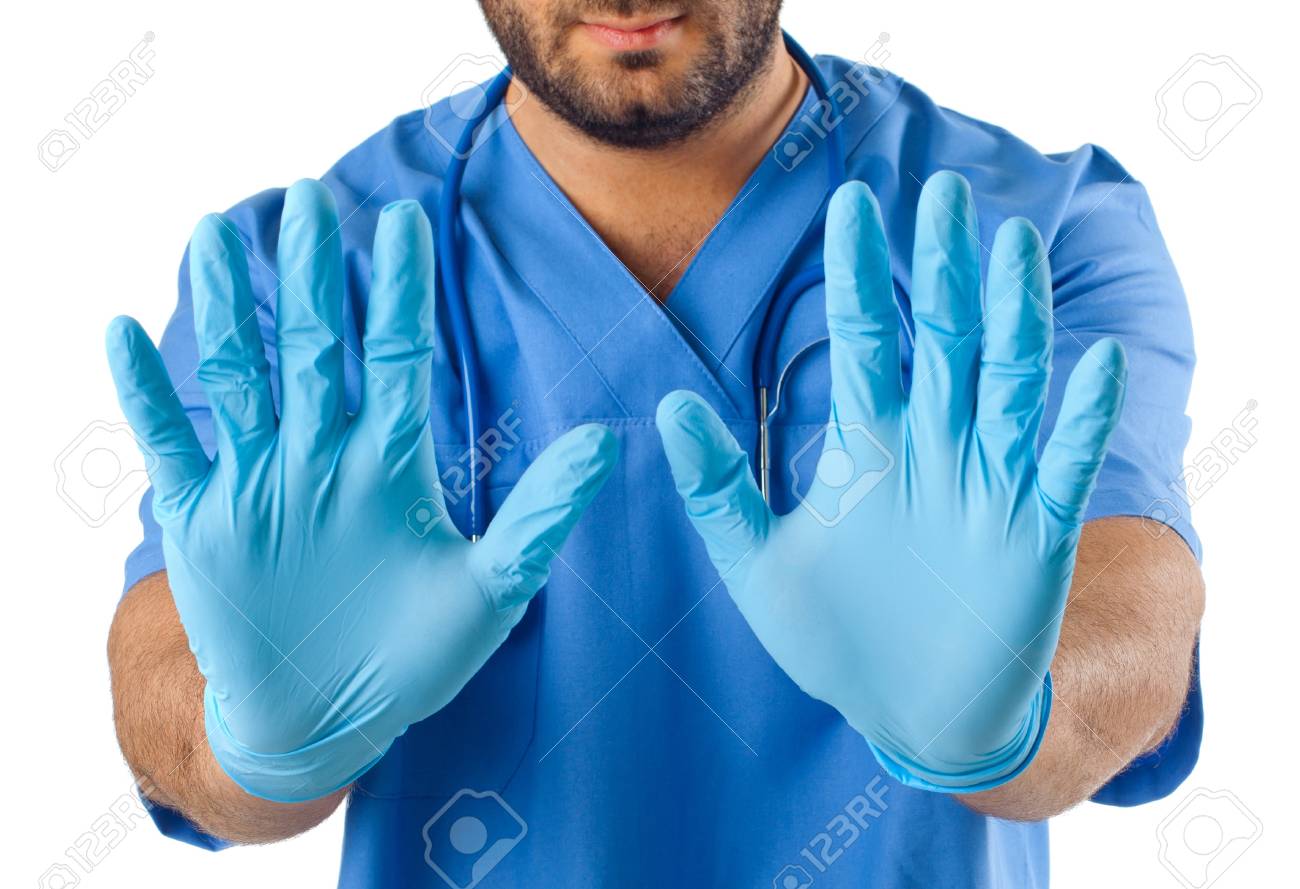 La Mano Del Hombre Con Guantes Quirúrgicos Azules Imágenes Y Fotografía De Archivo Libres De Derecho. 20596494.