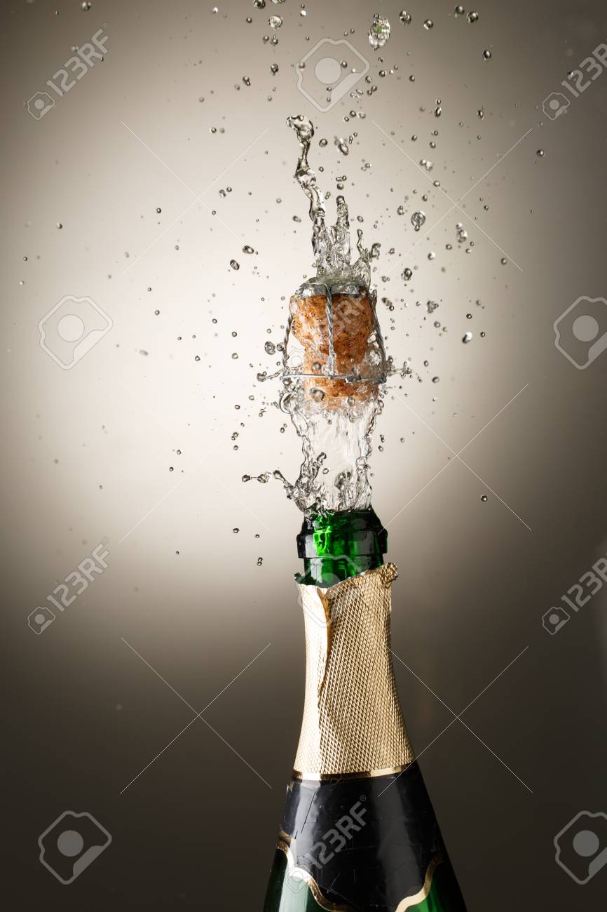 Champagne Bottle With Cork Popping And Splash Celebration Theme