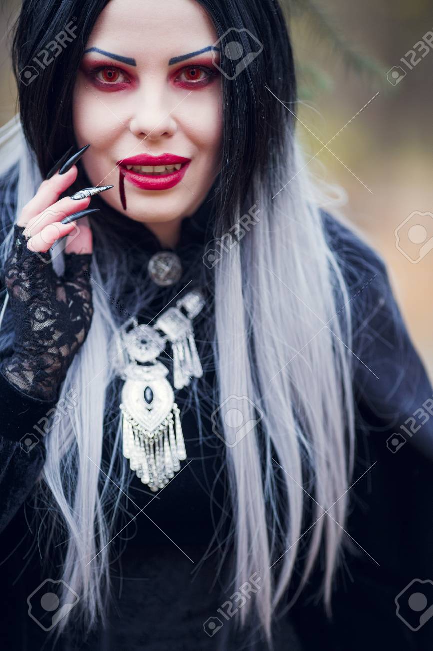 Image Of Smiling Vampire Girl With Stream Of Blood Near Mouth Stock Photo,  Picture and Royalty Free Image. Image 89610848., image size:866x1300
