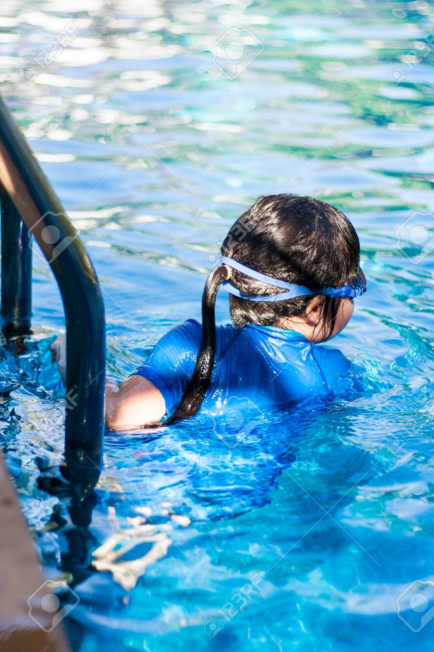 little thai girl swim A Little Thai Girl In Her Swimsuit At A Swimming Pool. Stock Photo, Picture  and Royalty Free Image. Image 40863509.