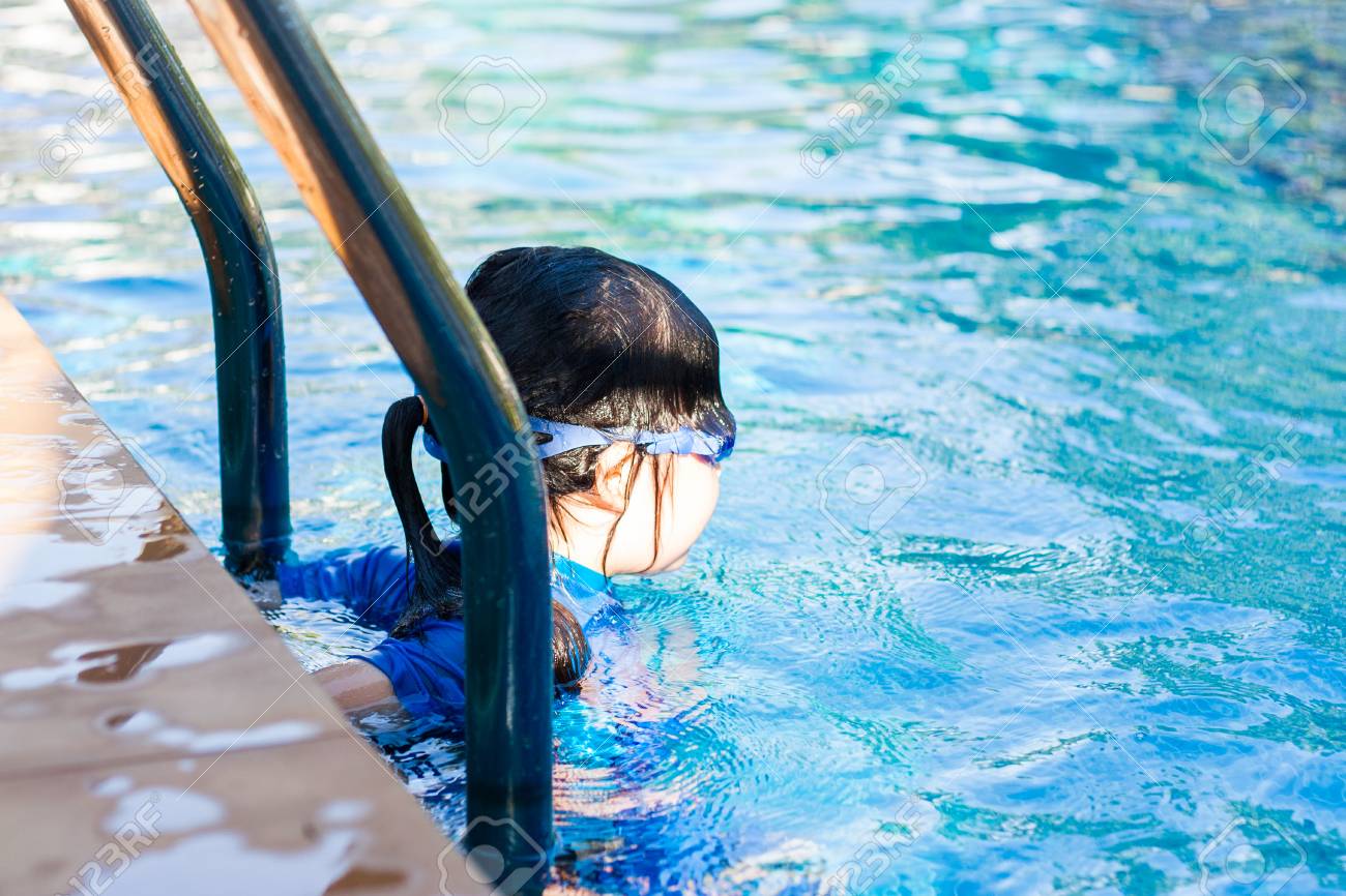 little thai girl swim A Little Thai Girl In Her Swimsuit At A Swimming Pool. Stock Photo, Picture  and Royalty Free Image. Image 40863508.