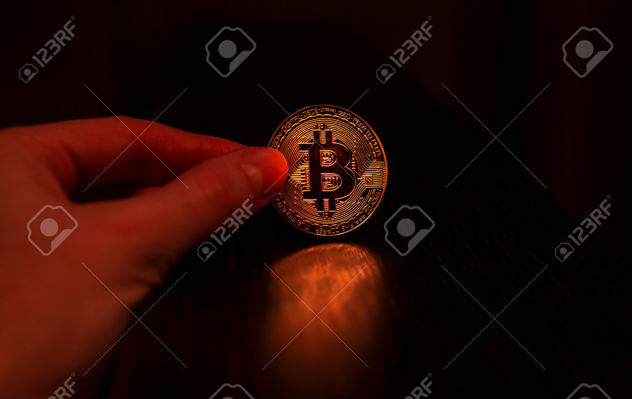 Hand Holding Bitcoin Coin On Black Background With Copy Space For Text 로열티  무료 사진, 그림, 이미지 그리고 스톡포토그래피. Image 165400731