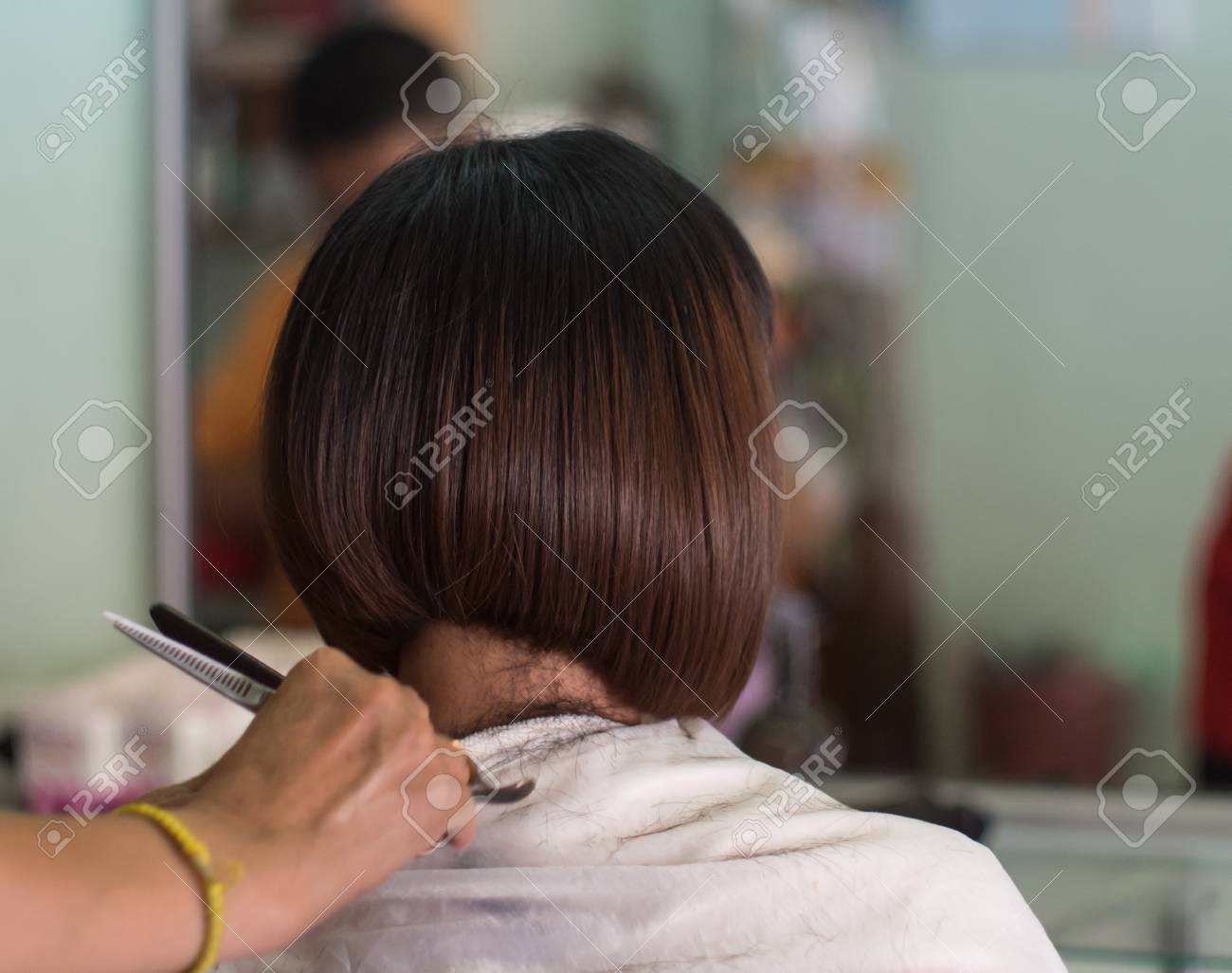 Hair Stylist Trimming Short Hair Young Asian Woman At Beauty
