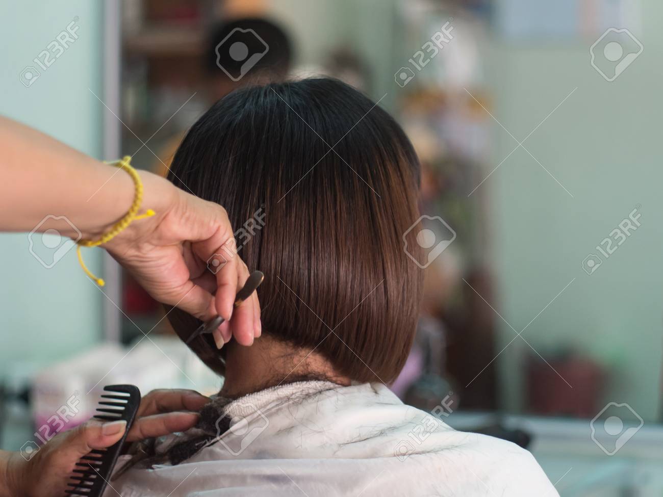 Hair Stylist Trimming Short Hair Young Asian Woman At Beauty