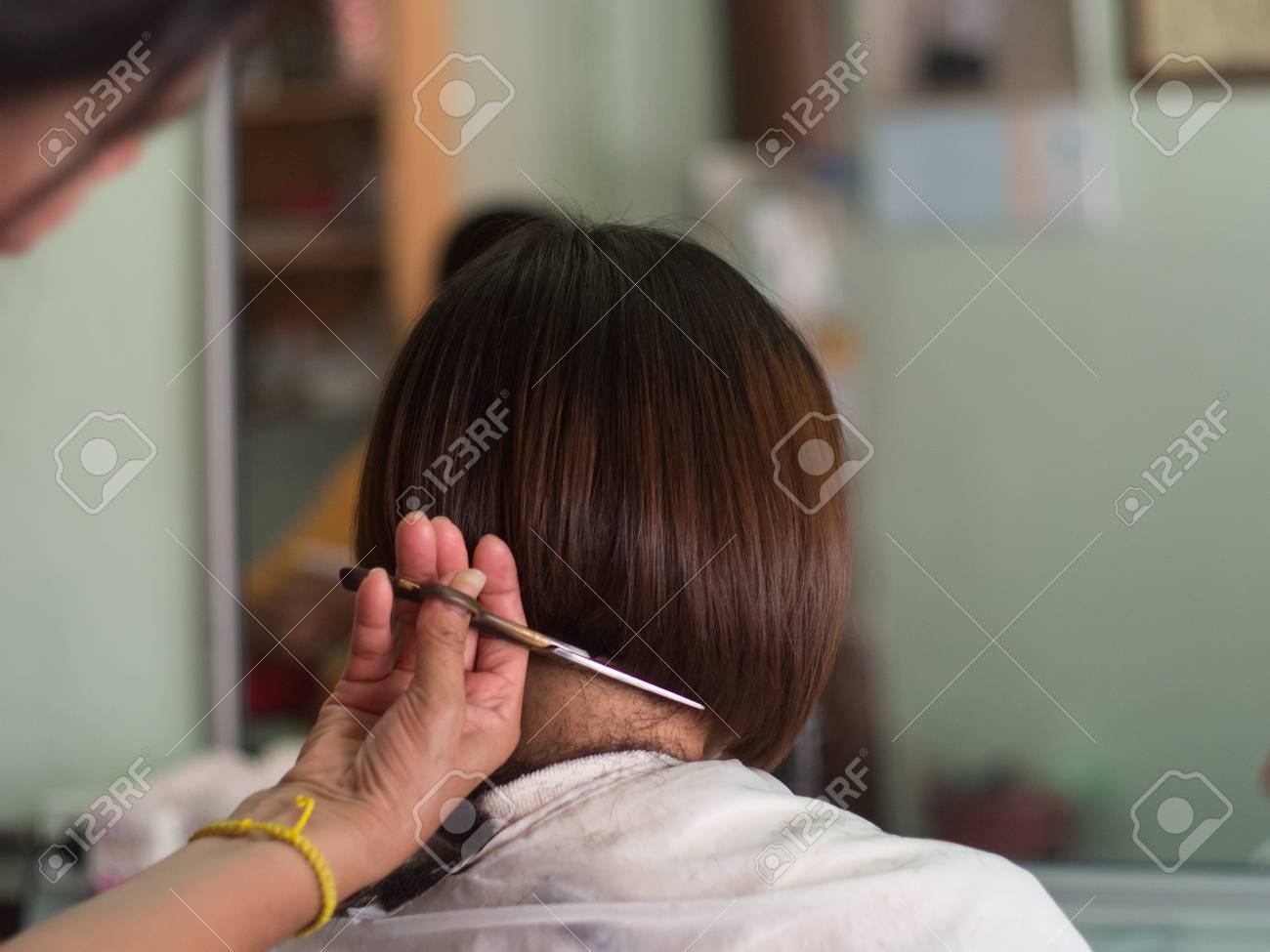 Hair Stylist Trimming Short Hair Young Asian Woman At Beauty