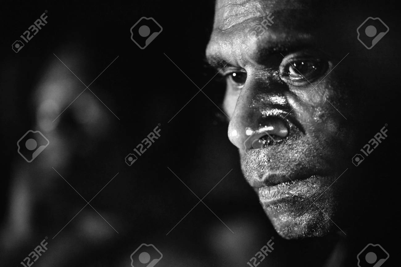 INDONESIA, IRIAN JAYA, ASMAT PROVINCE, JOW VILLAGE - JUNY 28: The Black and white Portrait Asmat man. June 28, 2012 in Jow Village, Asmat province, Indonesia - 15740659 INDONESIA, IRIAN JAYA, ASMAT PROVINCE, JOW VILLAGE - JUNY 28: The Black and white Portrait Asmat man. June 28, 2012 in Jow Village, Asmat province, Indonesia - 15740659