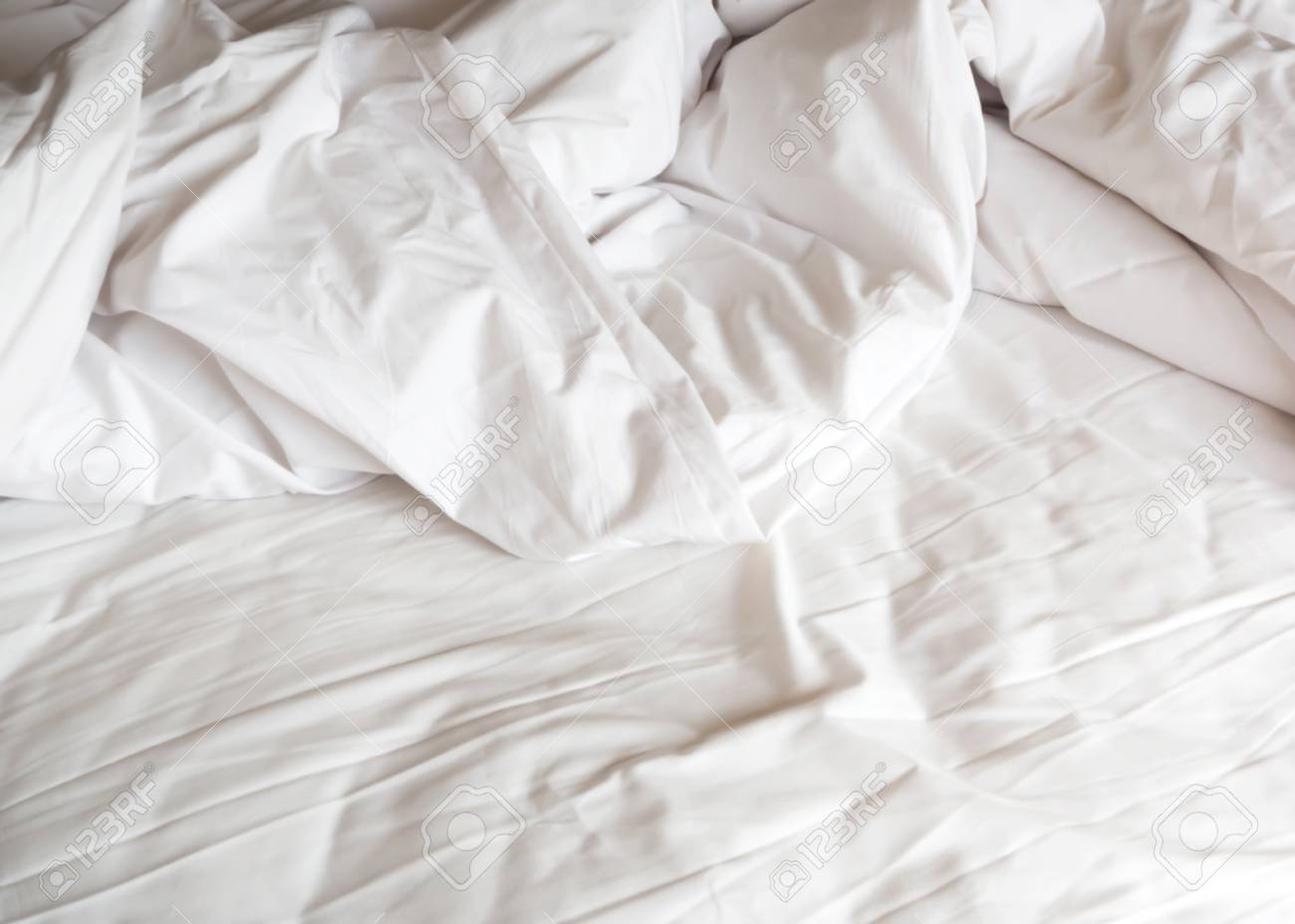 Messy Bed. White Pillow With Blanket On Bed Unmade. Concept Of Relaxing  After Morning. With Lighting Window. Mess White Blanket With Copy Space.  Stock Photo, Picture and Royalty Free Image. Image 89633136.