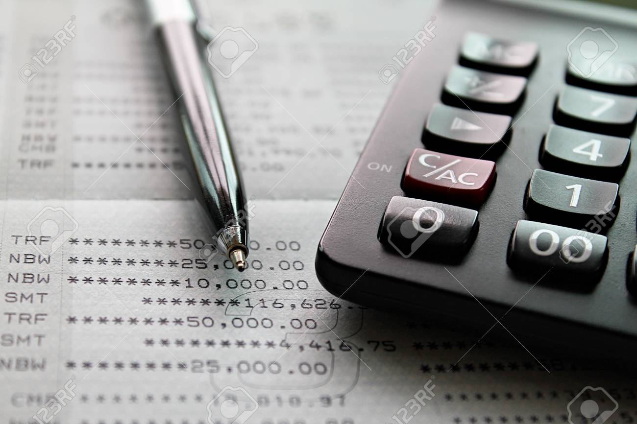 Business, finance, investment, accounting or taxes concept : Top view or flat lay of calculator and pen on savings account passbook or financial statement - 126599890 Business, finance, investment, accounting or taxes concept : Top view or flat lay of calculator and pen on savings account passbook or financial statement - 126599890