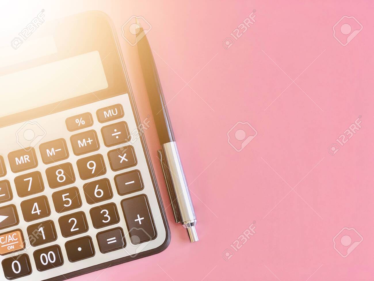 Business, finance, savings money, investment, taxes, money planning or accounting concept : Top view or flat lay of calculator and pen on pink background with copy space ready for adding or mock up - 134868456 Business, finance, savings money, investment, taxes, money planning or accounting concept : Top view or flat lay of calculator and pen on pink background with copy space ready for adding or mock up - 134868456