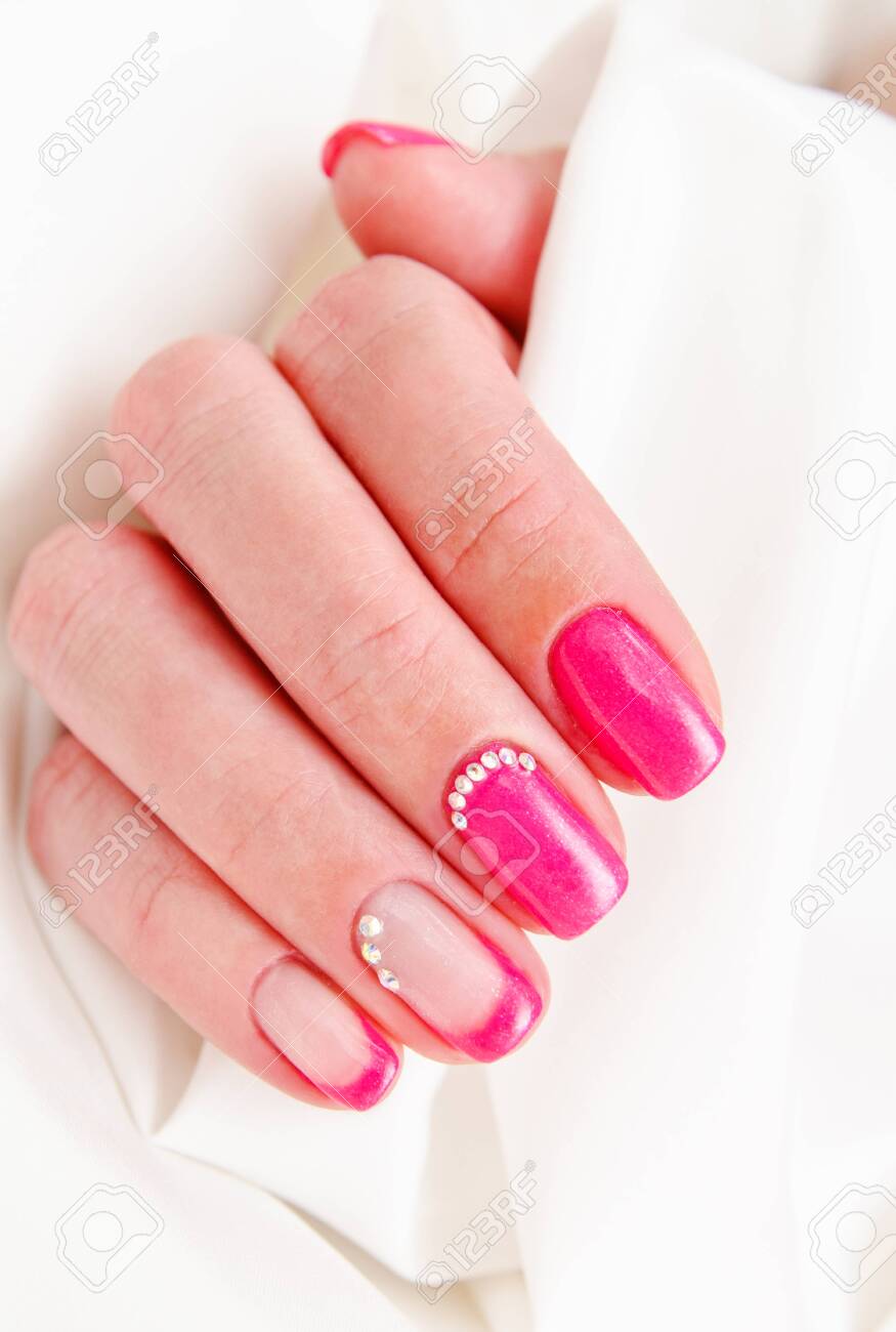 Woman's nails with beautiful manicure fashion design with gems - 121717278 Woman's nails with beautiful manicure fashion design with gems - 121717278