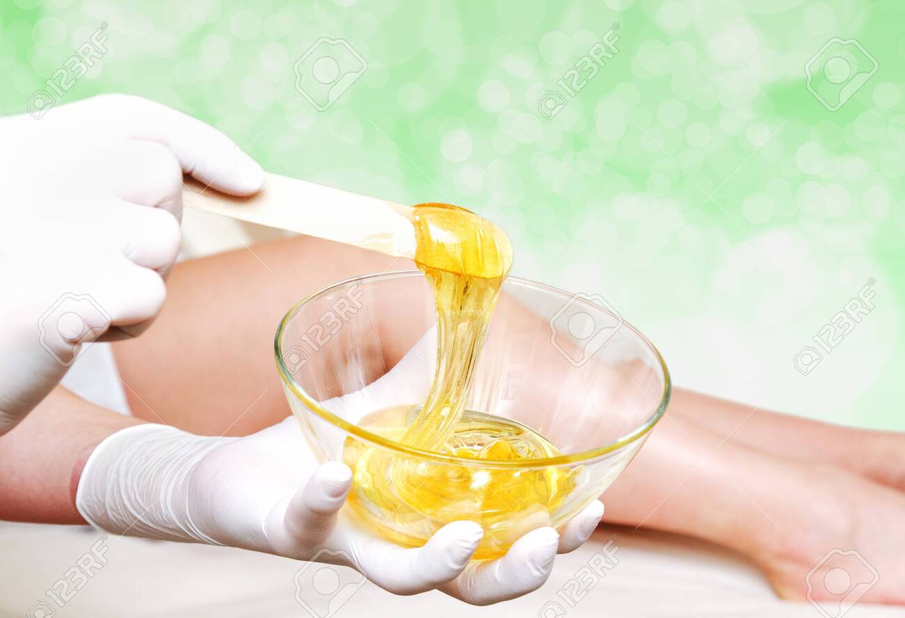 Cosmetologist Beautician Master Holding Bowl With Hot Wax For