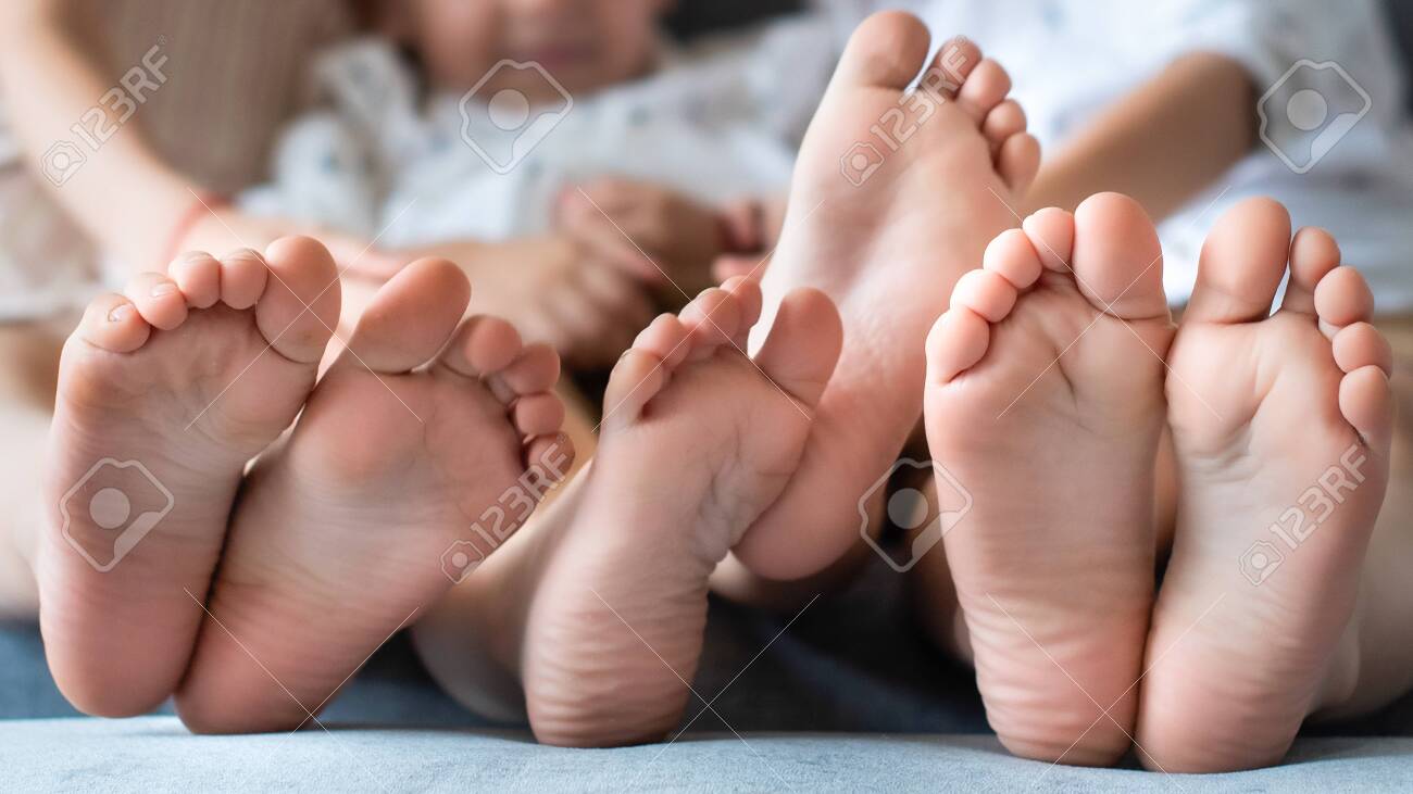 baby legs in the frame. barefoot brother and sister. three. wrinkled. fun together. - 158362150 baby legs in the frame. barefoot brother and sister. three. wrinkled. fun together. - 158362150