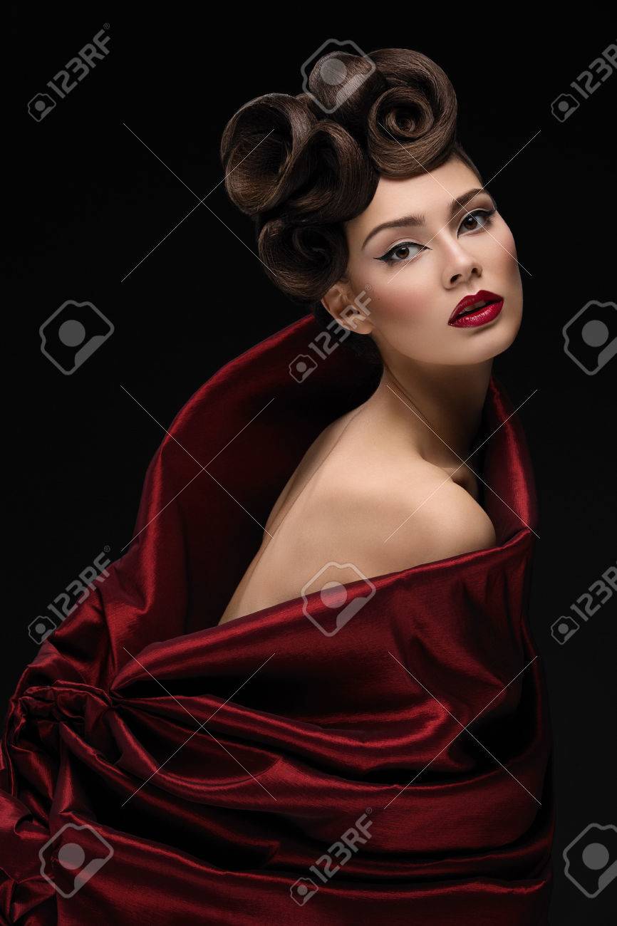 Beautiful young woman with fashionable hairstyle and makeup in red textile looking like tulip - 40804251 Beautiful young woman with fashionable hairstyle and makeup in red textile looking like tulip - 40804251