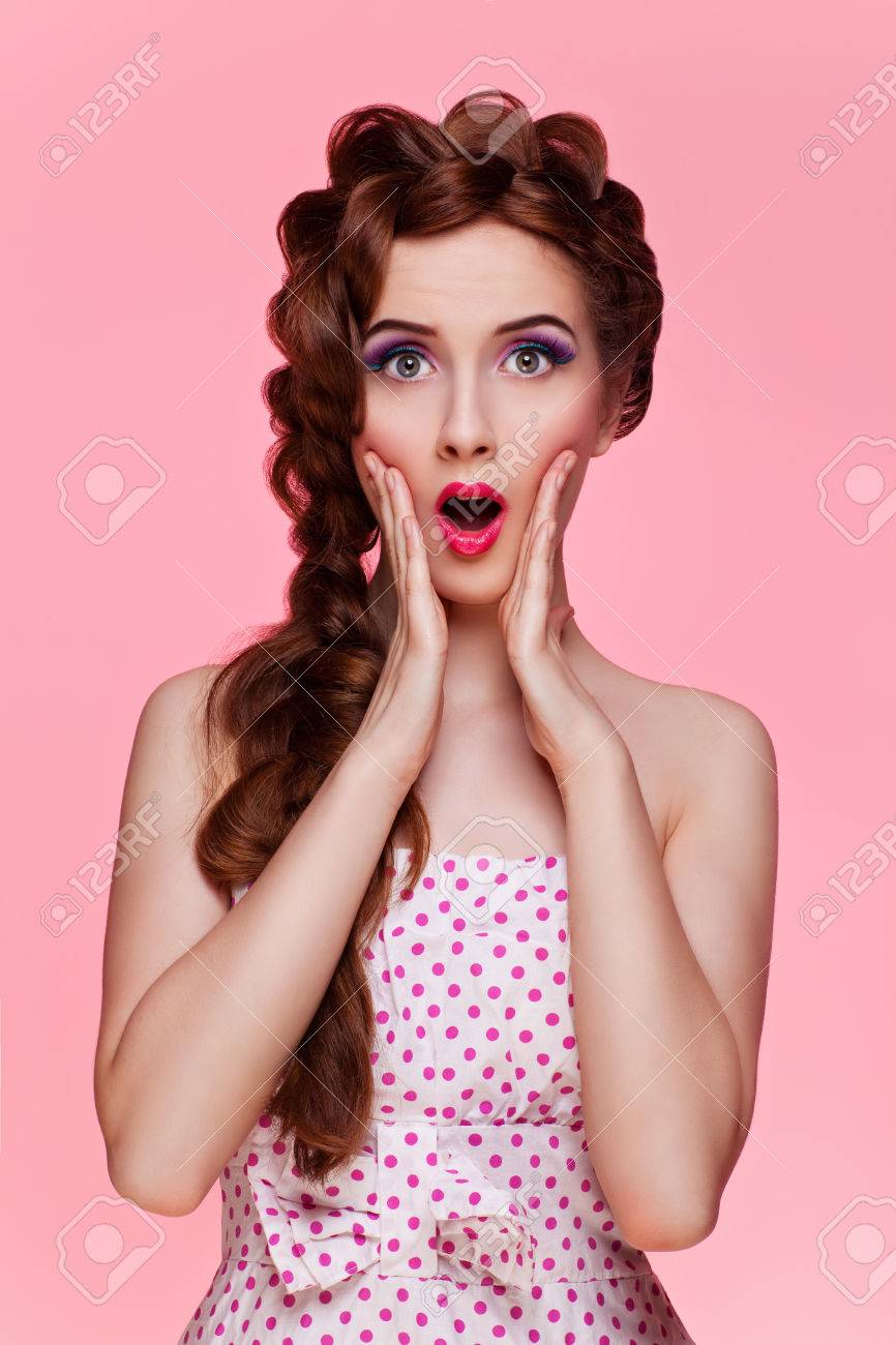 Portrait of beautiful retro style young woman with surprise expression. Isolated over pink background. - 42535668 Portrait of beautiful retro style young woman with surprise expression. Isolated over pink background. - 42535668