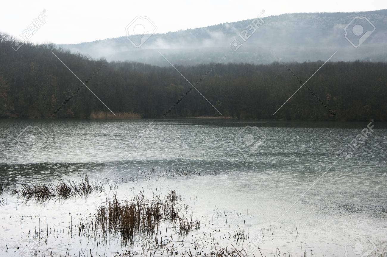 Lake And Misty Mountains In Background At Rainy Day Bad Weather Rain Falls Stock Photo Picture And Royalty Free Image Image 75464134
