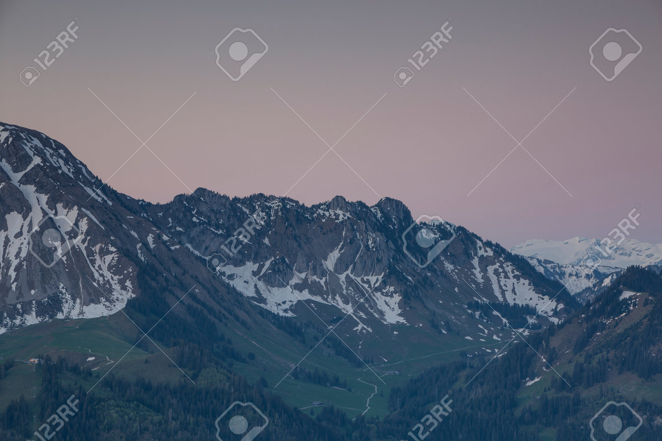Sunrise over Friborg alps in Switzerland. Sunny blue sky. - 170451870 Sunrise over Friborg alps in Switzerland. Sunny blue sky. - 170451870