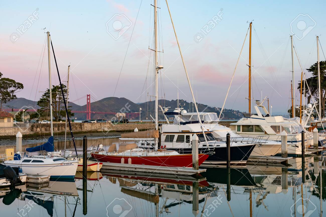 San Francisco, California / USA - Feb 7th 2019 - yachts in a marina in front of Golden Gate Bridge on February morning - 138674062 San Francisco, California / USA - Feb 7th 2019 - yachts in a marina in front of Golden Gate Bridge on February morning - 138674062