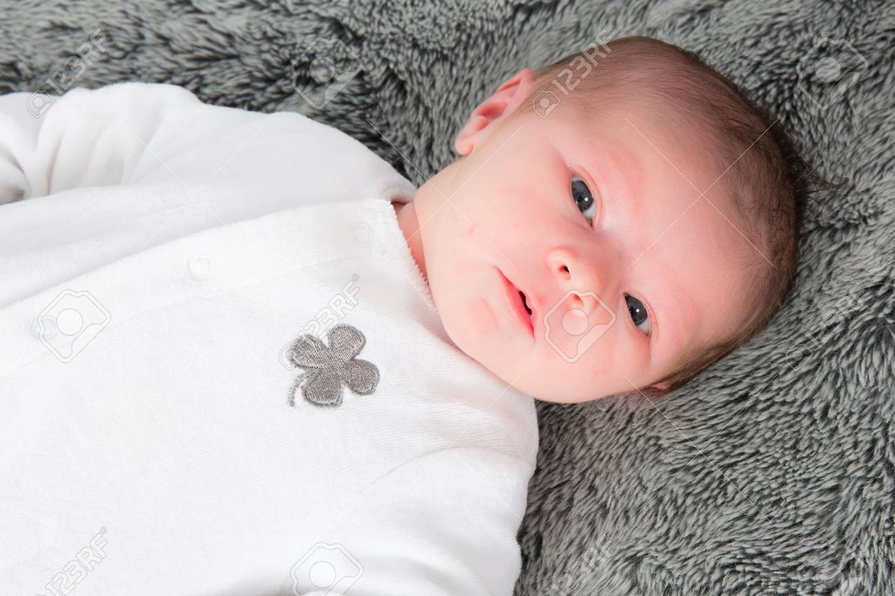 Very Cute One -month Old Baby In A Grey Blanket Stock Photo ...