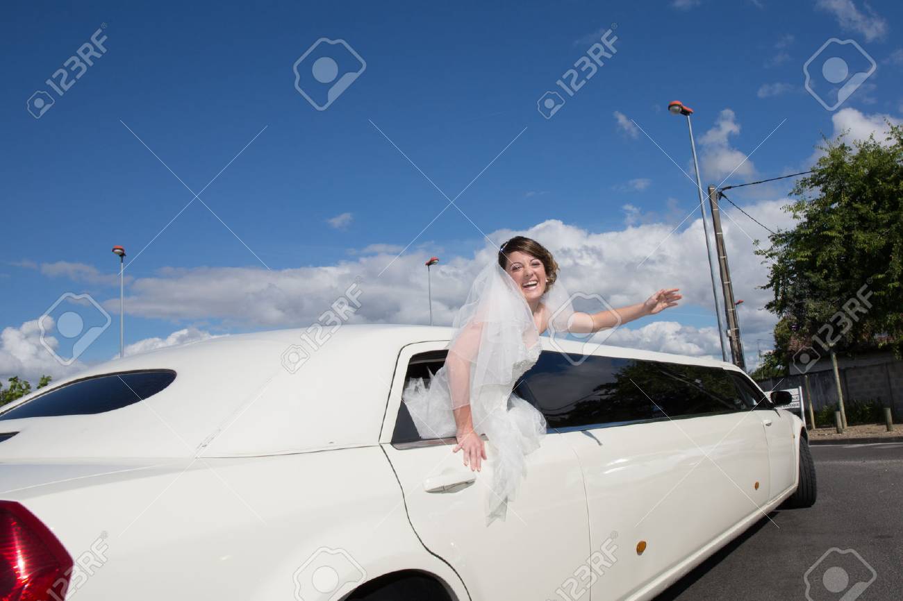 Luxury limo limousine with a bride under blue sky - 45157515 Luxury limo limousine with a bride under blue sky - 45157515