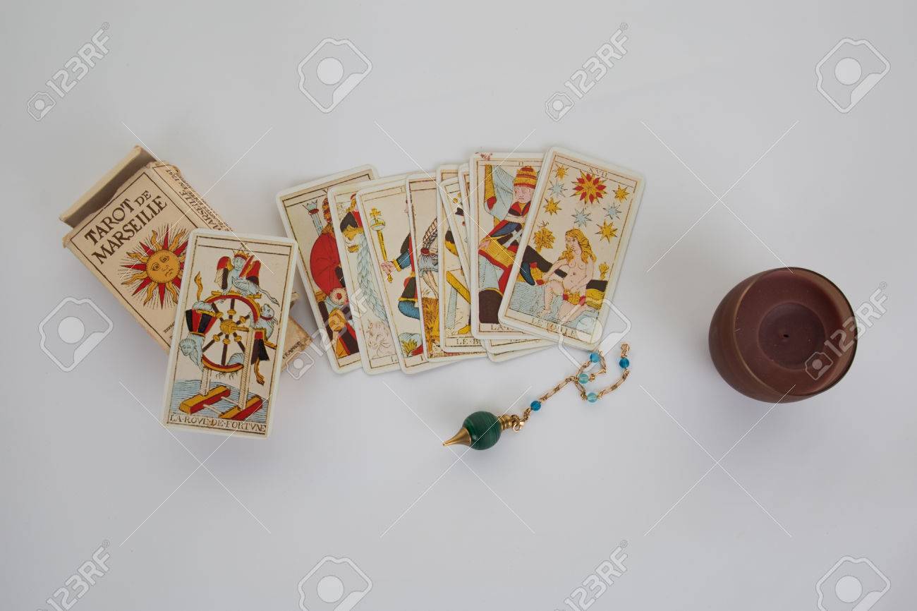 Tarot cards for a fortune -teller and pendulum isolated on white - 49059249 Tarot cards for a fortune -teller and pendulum isolated on white - 49059249