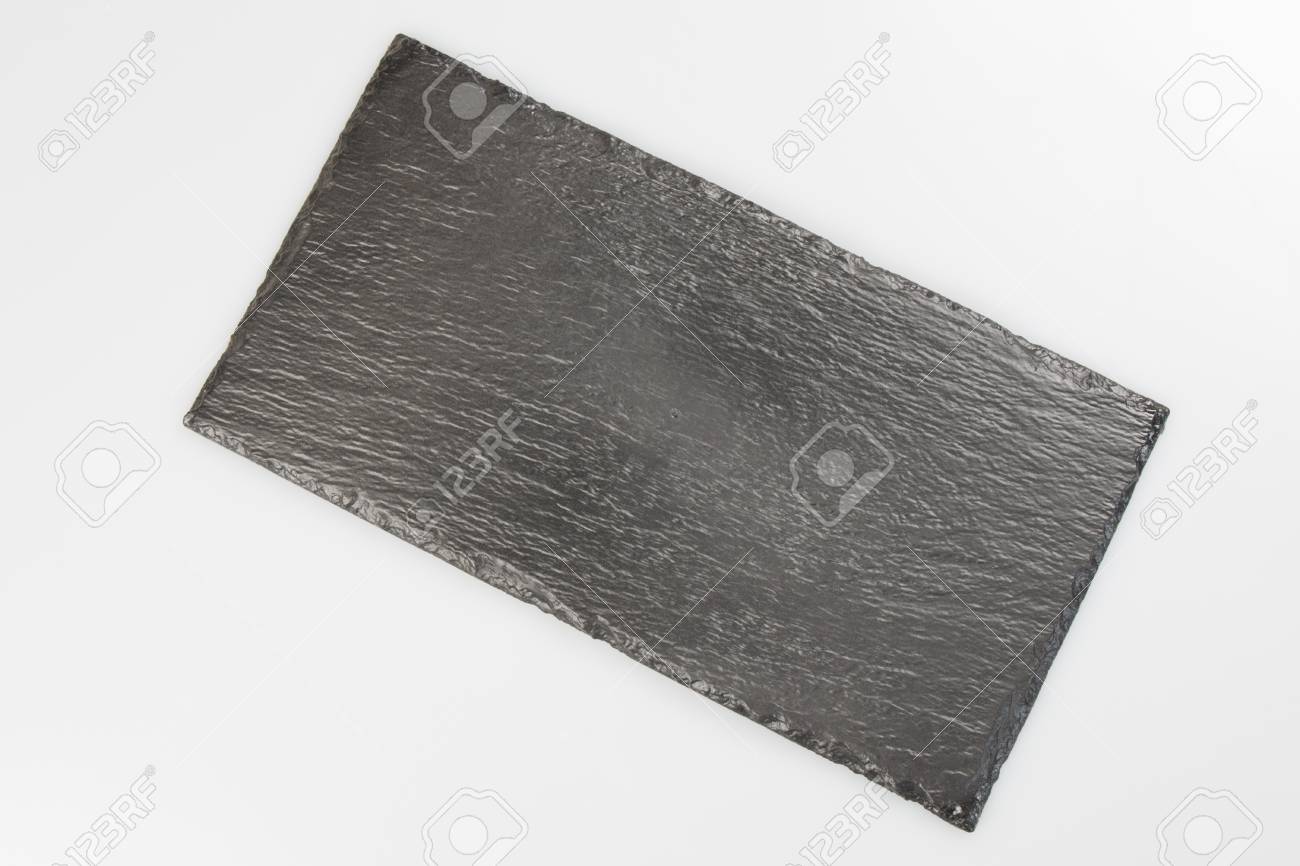 blank black stone plate isolated on white background with copy