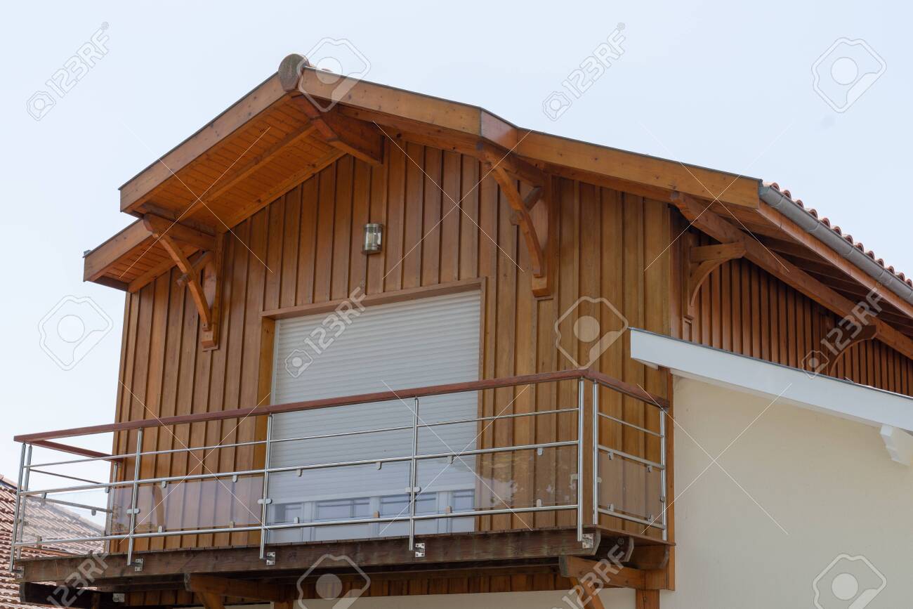 clean wooden facade with window of modern wood house with glass transparent railing - 128196049 clean wooden facade with window of modern wood house with glass transparent railing - 128196049