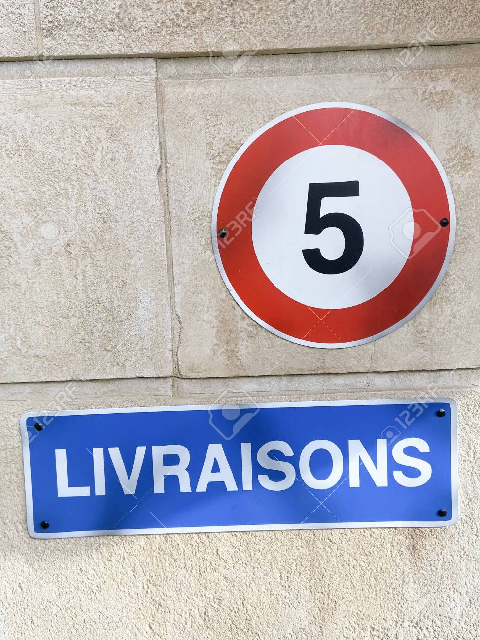 French Sign Livraisons Means Deliveries And Road Sign To Limit The Speed To 5 Km H Stock Photo Picture And Royalty Free Image Image