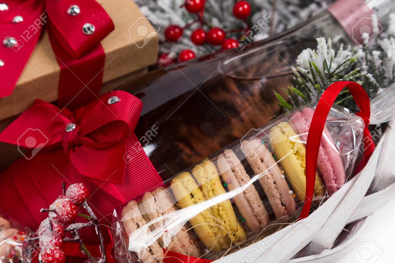 Christmas Present In Basket With Sweet Pastry, Bottle Of Wine And Decor  Stock Photo, Picture And Royalty Free Image. Image 47290177.
