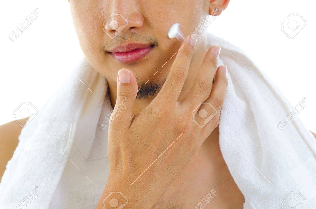 putting lotion on face