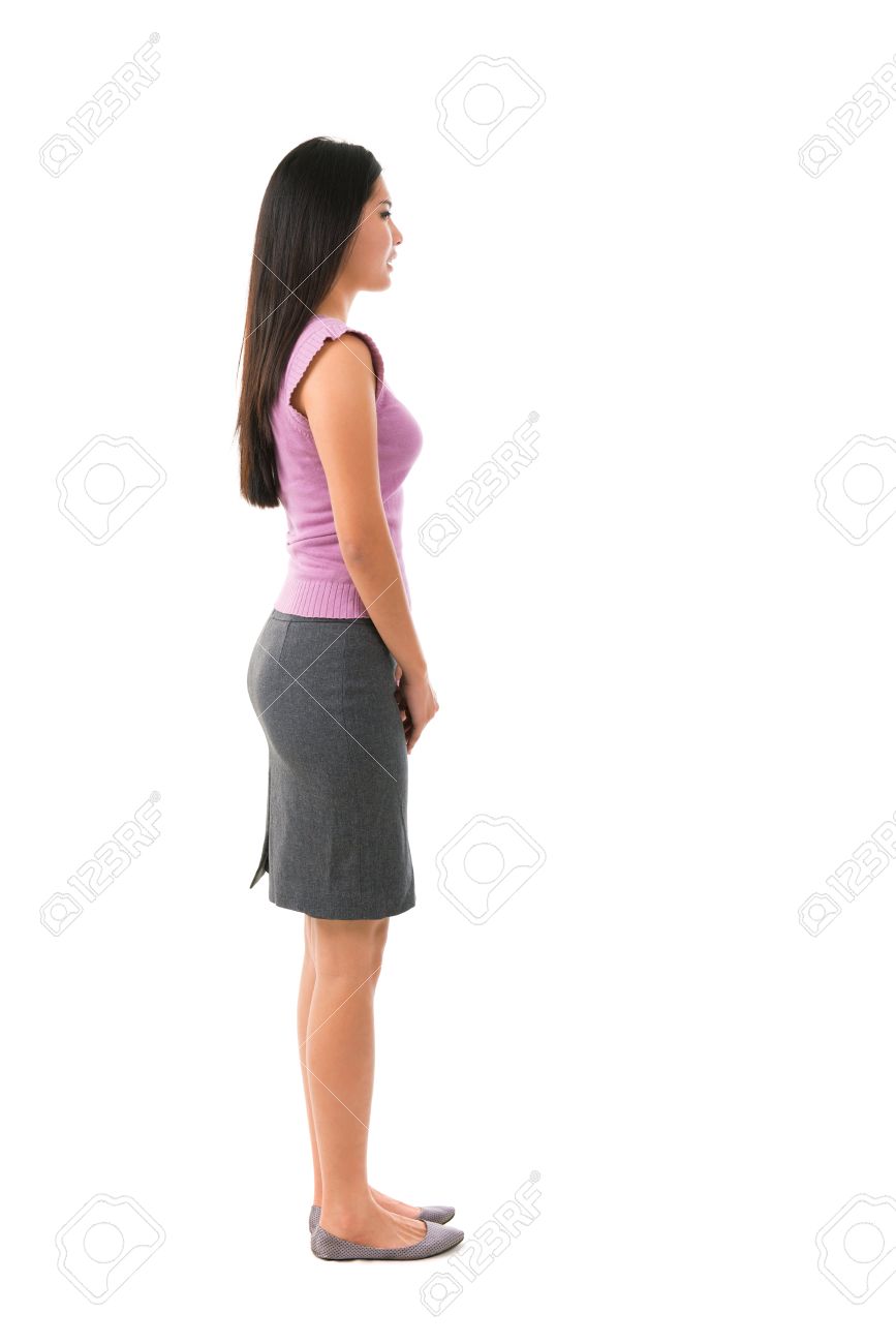 Side view full body of Asian female in office attire standing over white background - 15429802 Side view full body of Asian female in office attire standing over white background - 15429802