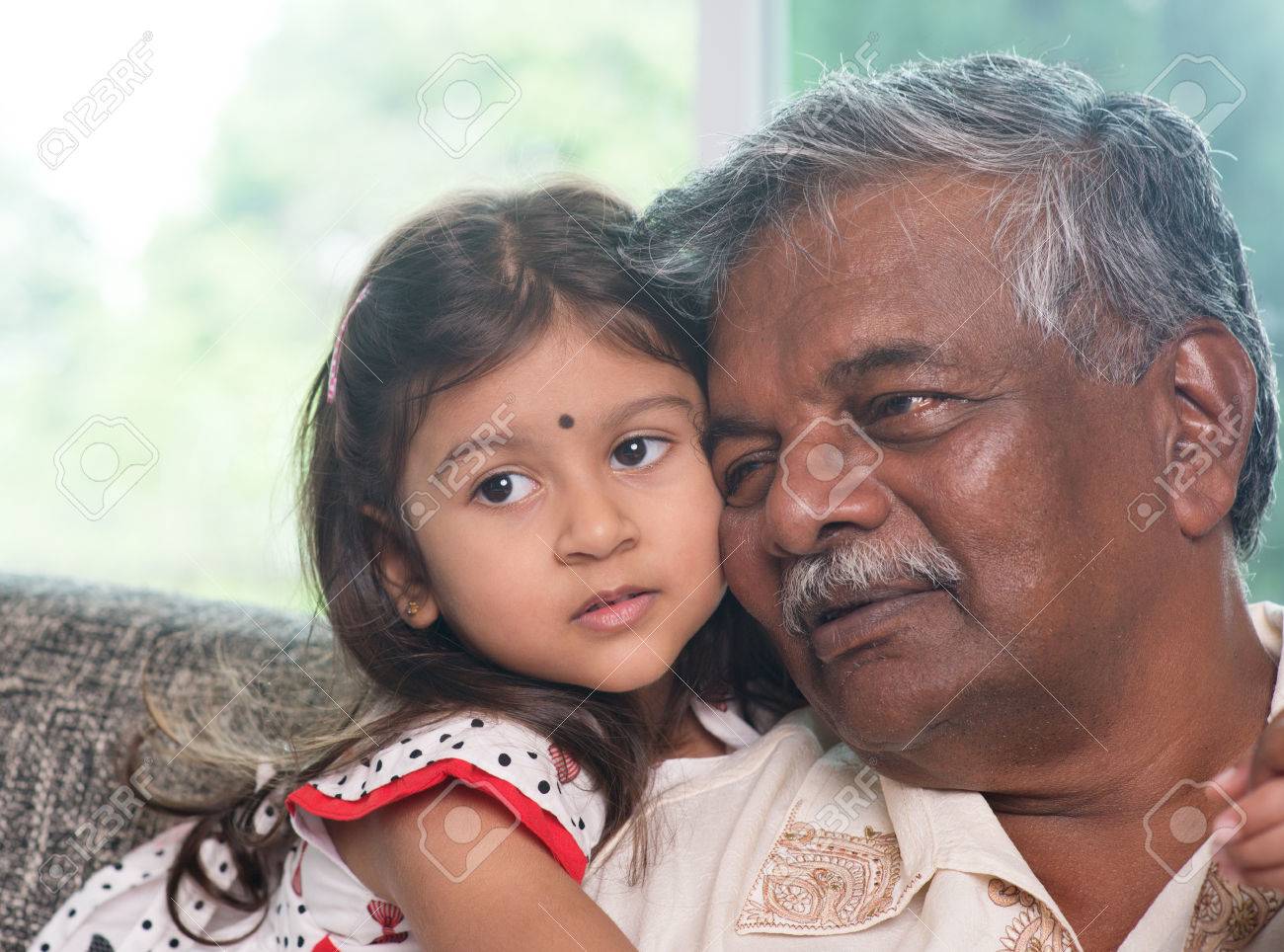 portrait indian family at home grandparent and grandchild close