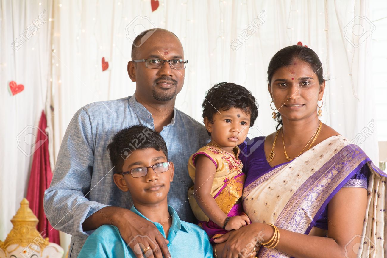 Indian parents and children in a blessing ceremony. Traditional India family portrait. - 51616431 Indian parents and children in a blessing ceremony. Traditional India family portrait. - 51616431
