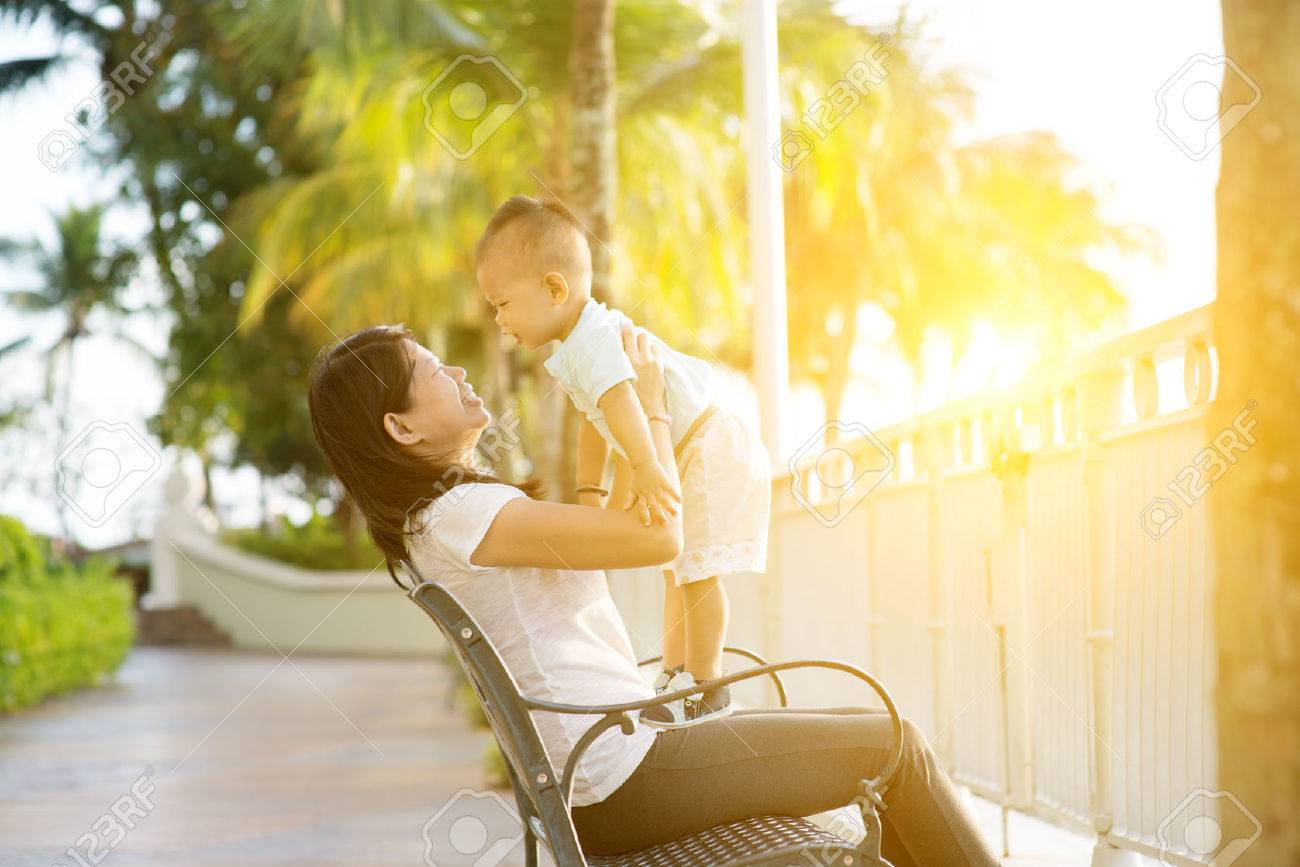Mother and son having fun at outdoor in sunset during holidays. - 52944245 Mother and son having fun at outdoor in sunset during holidays. - 52944245
