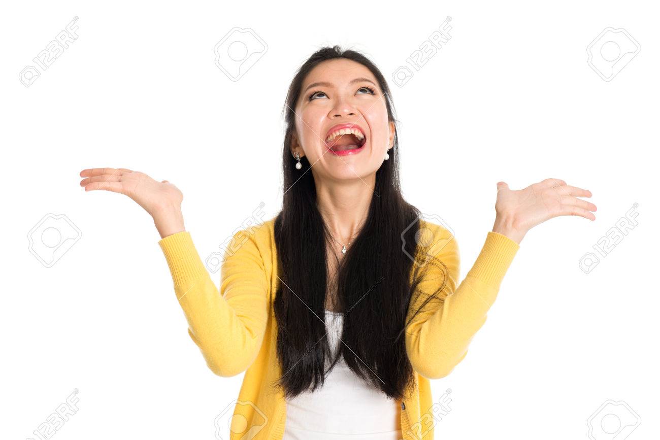 Surprised Asian woman mouth open wide, shouting and looking up, standing isolated on white background. - 69756507 Surprised Asian woman mouth open wide, shouting and looking up, standing isolated on white background. - 69756507